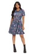 Alternative witchcore longline dress featuring scattered apothecary illustrations, potion bottles, herbs and mystical details. Designed with a fitted bodice and relaxed longline skirt, this goth aesthetic dress is ideal for dark academia, pagan fashion and whimsical witch outfits.