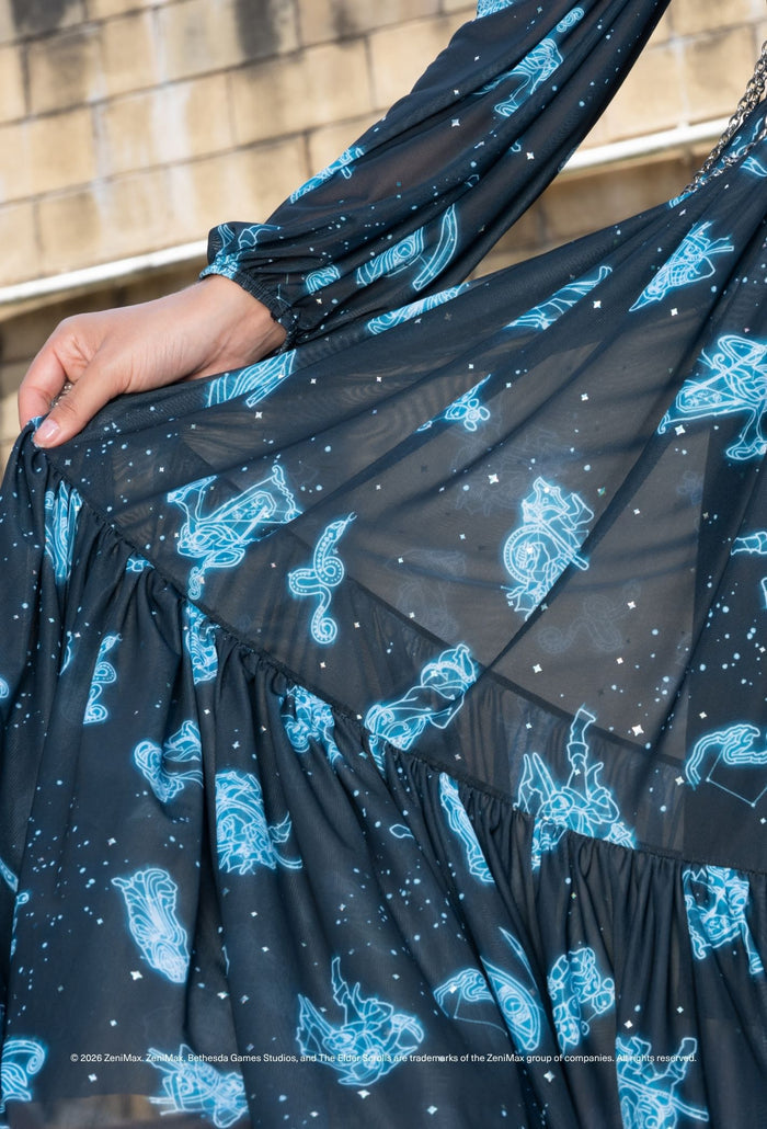 Elder Scrolls apparel maxi dress with Aurbis themed artwork, flowing skirt and bishop sleeve silhouette