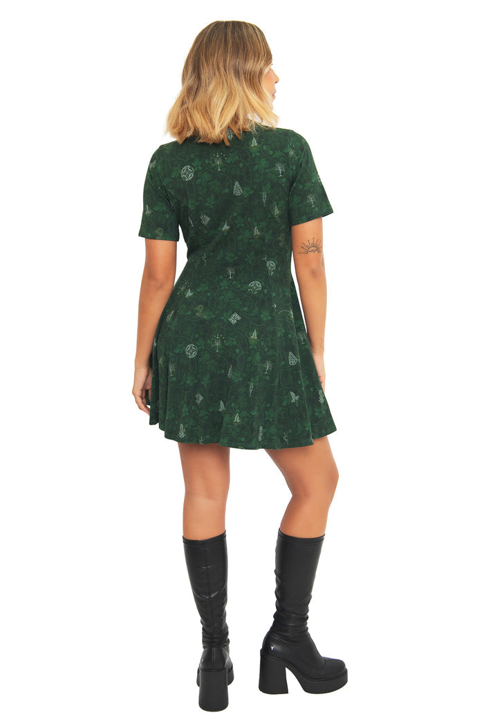 Back view of the BlackMilk Lord of the Rings Bag End Wallpaper Evil Tee Dress, showing the flared skater skirt and cosy Bag End wallpaper print in deep green.