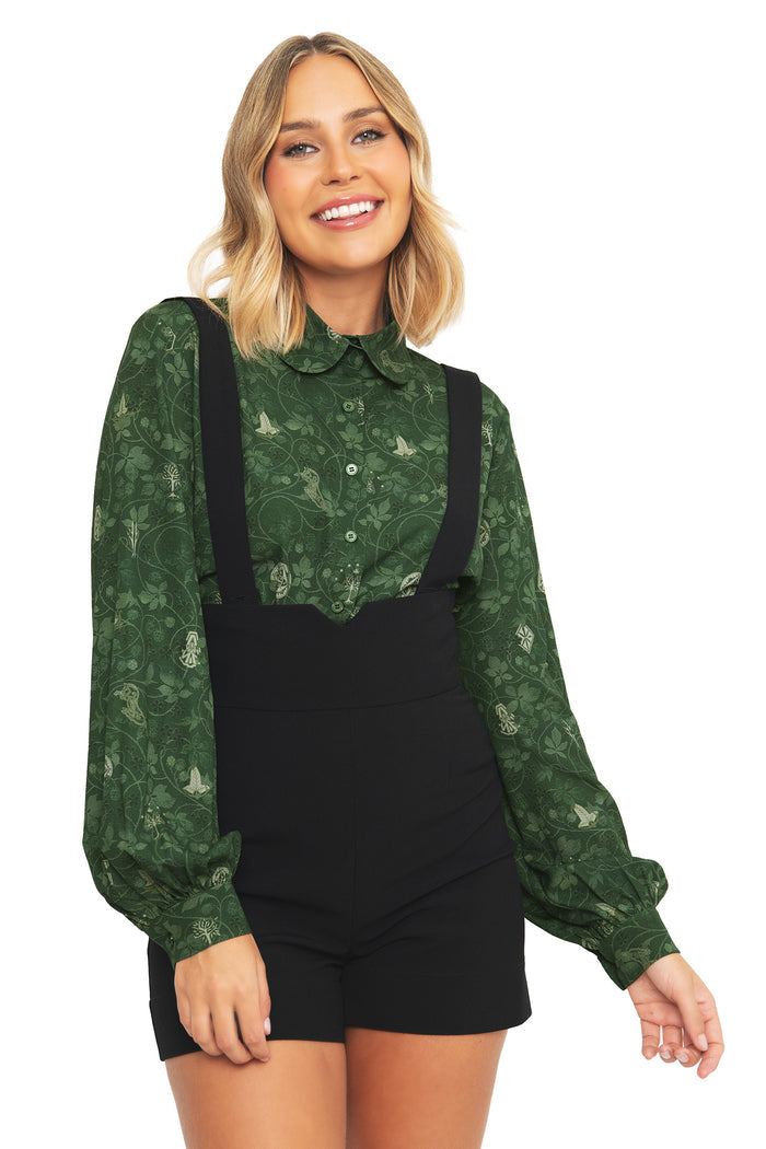 Close-up front view of the BlackMilk Lord of the Rings Bag End Wallpaper Long Sleeve Blouse, showing the Peter Pan collar and buttoned placket in deep green.