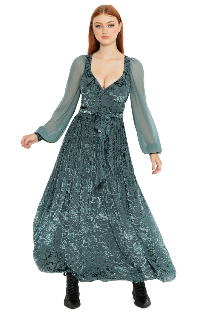 Close up styling of the Be With Me Always Juniper Burned Velvet Sheer Romance Maxi Dress, showcasing the sheer sleeve, floral velvet detailing and dramatic movement