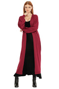 Model wearing the Berry Super Cardigan, a longline berry red cardigan with relaxed fit and open front styling layered over a black maxi dress