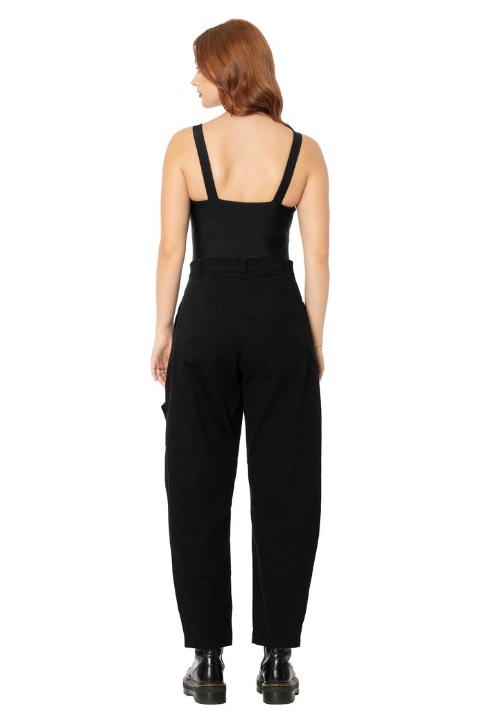 Alternative black cargo pants featuring a barrel leg silhouette, spacious functional pockets, scrunch seam detailing and soft cotton fabric for effortless everyday styling.