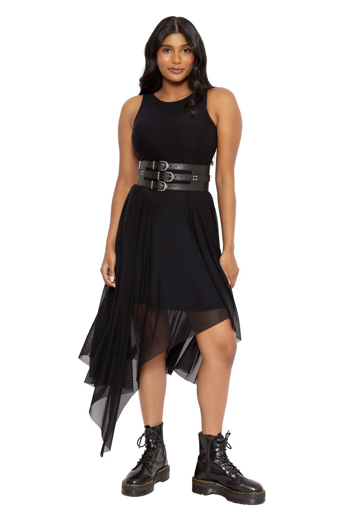 Corporate goth black mesh dress with a floaty handkerchief hem, fitted waist and sheer layered skirt. This minimalist gothic dress combines dark fairycore and alternative fashion aesthetics with an elegant all-black silhouette perfect for everyday witchy styling.