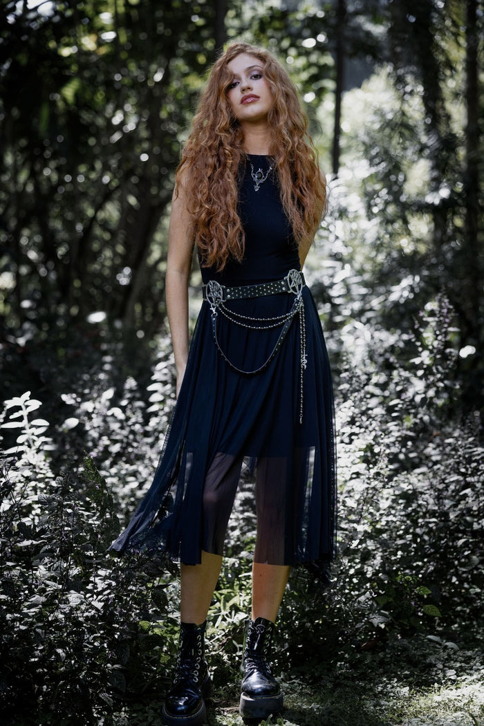Black gothic handkerchief dress with sheer mesh layering and an asymmetric draped hem for effortless corporate goth styling. This alternative black dress blends dark academia, whimsigoth and modern gothic fashion with a fitted bodice and flowing silhouette.