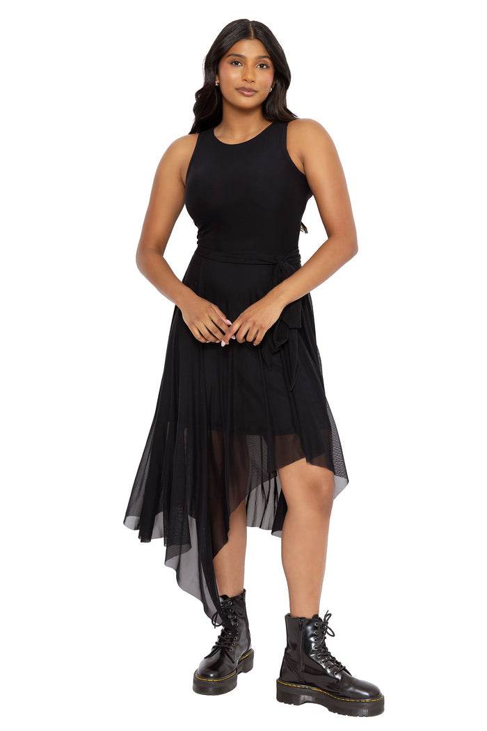 Whimsigoth black asymmetric dress featuring sheer mesh layers, a fitted bodice and dramatic flowing hems. This gothic midi dress blends dark academia and fantasy witch fashion with a sleek minimalist goth aesthetic.