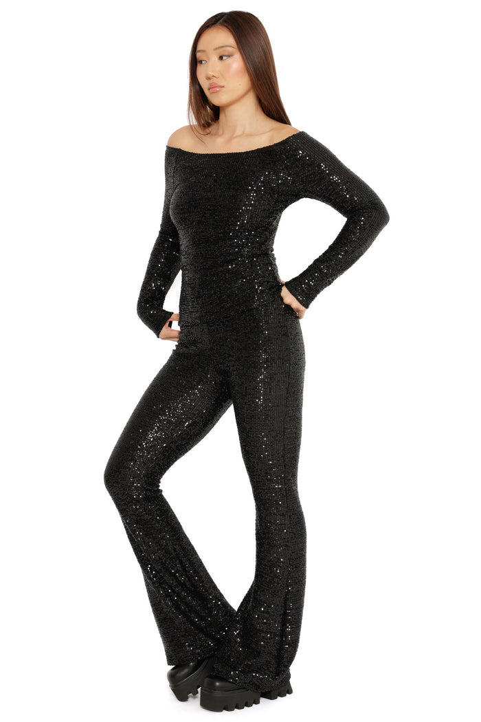 sparkly black flared trousers festive holiday styling