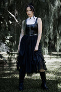 Gothic black tulle skirt featuring layered mesh fabric, a floaty midi silhouette and romantic ballerina inspired movement. Perfect for corporate goth, fantasy witch and dark academia outfits, this alternative skirt adds dramatic witchcore energy to any look.