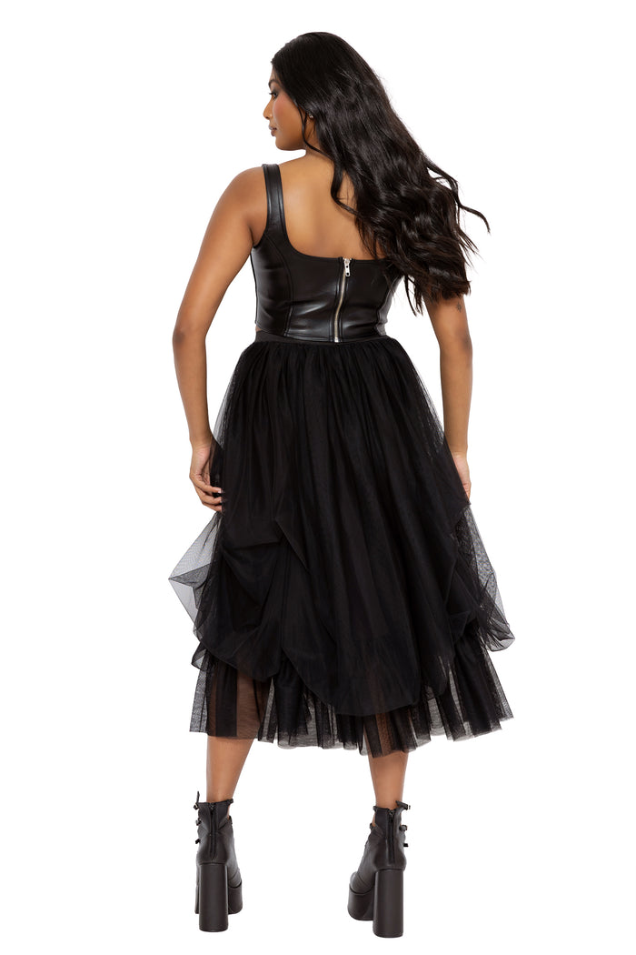 Whimsigoth black midi skirt with soft gathered tulle layers and flowing gothic volume inspired by dark fairycore fashion. This alternative witch skirt combines ballerina witch aesthetics with romantic gothic styling and effortless everyday wear.