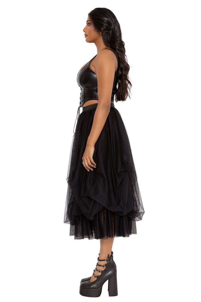 Ballerina witch inspired black tulle skirt featuring soft gathered mesh layers and a romantic flowing midi silhouette. This whimsigoth skirt combines gothic fashion and modern pagan aesthetics with dramatic movement and floaty texture.