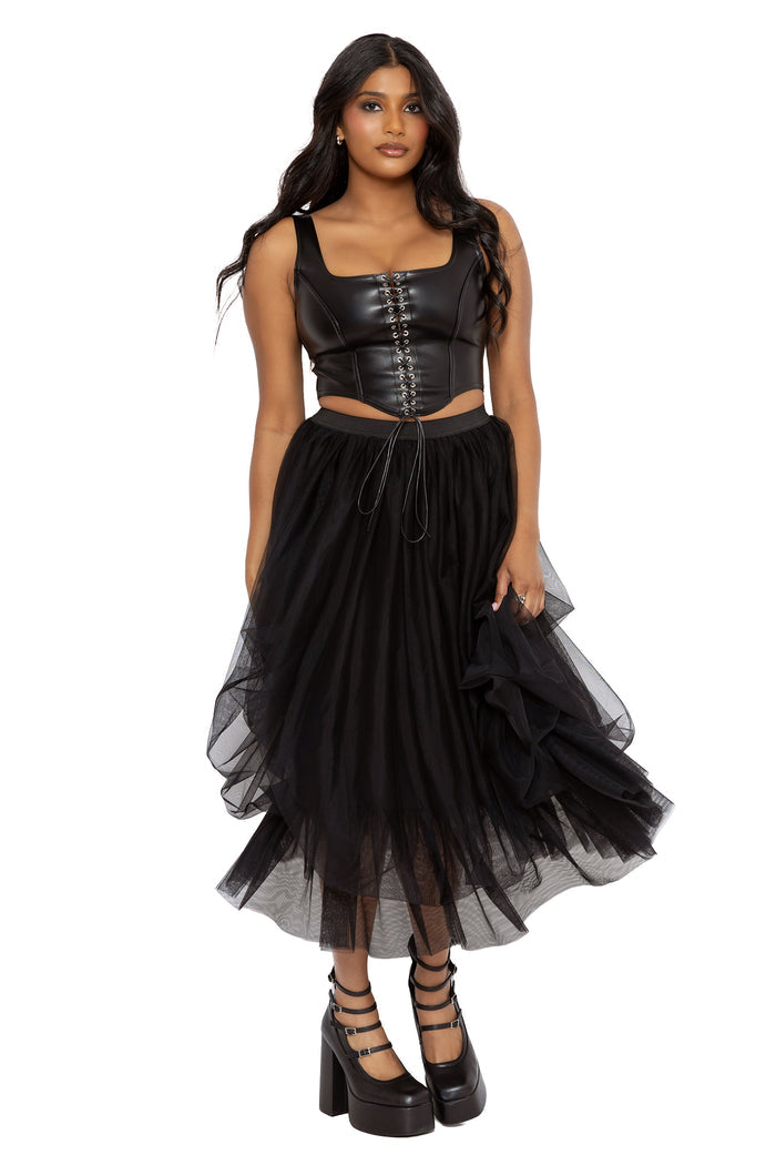 Gothic layered tulle skirt in all black with soft mesh gathering and dramatic floaty movement. This fantasy witch midi skirt captures dark fairycore and alternative goth fashion with an effortlessly romantic witchcore aesthetic.