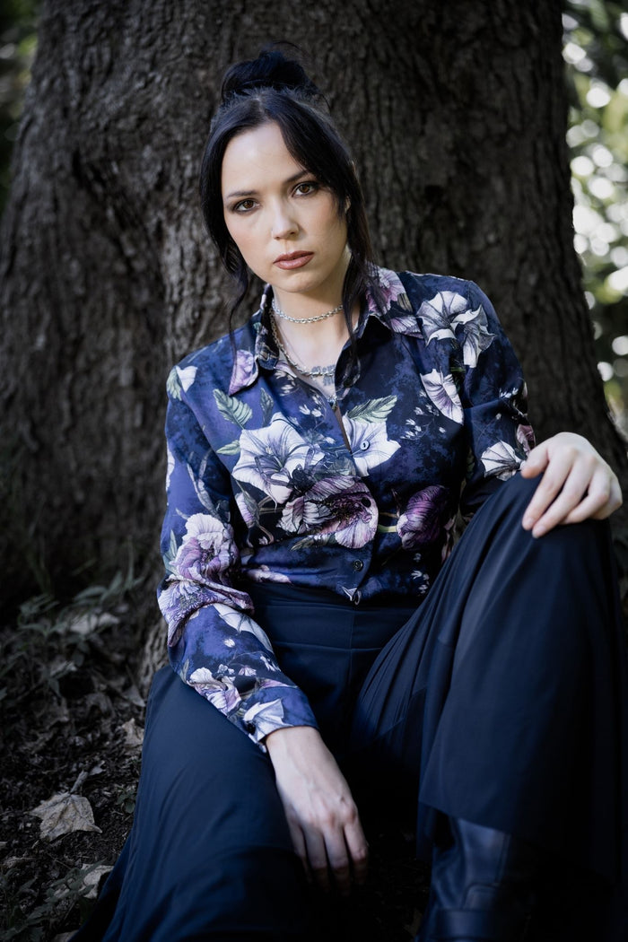 Corporate goth button-up shirt with dark floral artwork and hidden creepy crawlies woven throughout a moody botanical print. This alternative office shirt blends dark academia, whimsigoth and gothic fashion with a relaxed tailored silhouette perfect for witchy workwear styling.