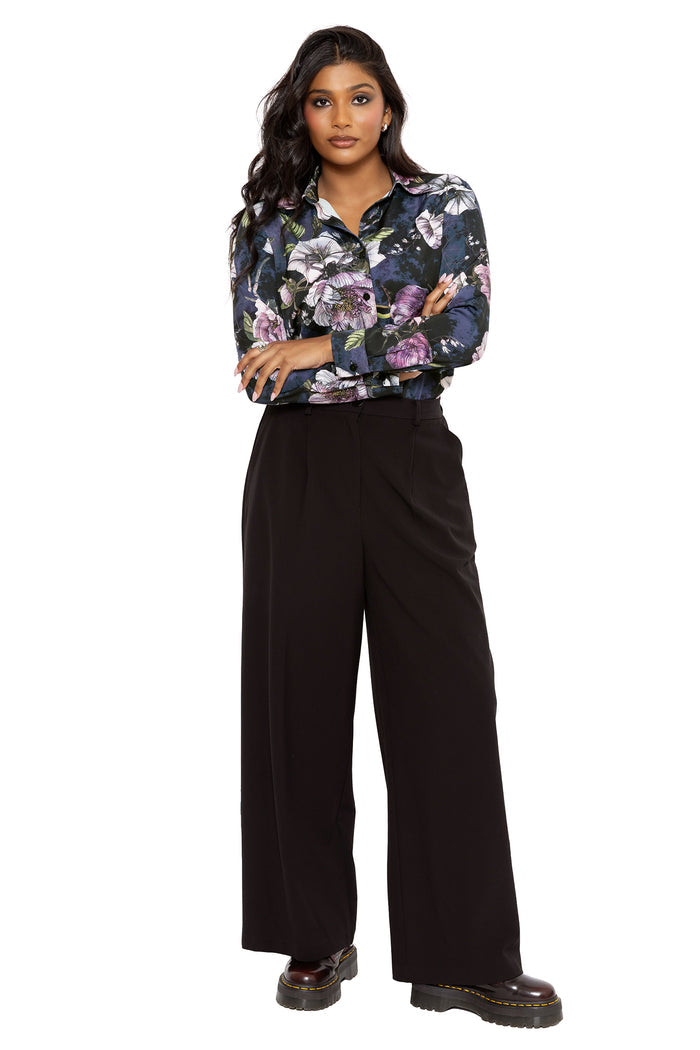 Gothic long sleeve business shirt featuring romantic florals and subtle insect details hidden amongst dark blooms. Designed with a collared button-up silhouette and lightweight fabric, this corporate goth shirt combines fantasy witch and modern officewear aesthetics.