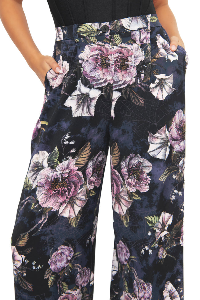 Gothic floral wide leg pants with hidden spider details amongst romantic midnight blooms in deep dark tones. Featuring a flattering high waist and breezy relaxed fit, these alternative goth pants capture corporate witch and fantasy fashion energy.