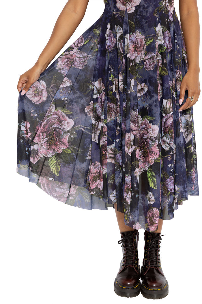 Dark academia floral swoop dress with hidden spider motifs and dramatic dipped hems for an elegant gothic silhouette. This corporate goth dress combines whimsigoth and fantasy witch fashion with floaty mesh movement and sophisticated office-ready styling.