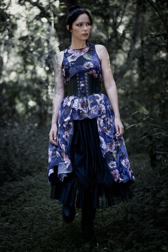 Gothic floral swoop dress with hidden spider artwork woven through moody blooms and dark botanical details. This whimsigoth mesh dress blends dark fairycore, cottage witch and gothic fashion aesthetics with a floaty layered skirt and dramatic dipped hems.