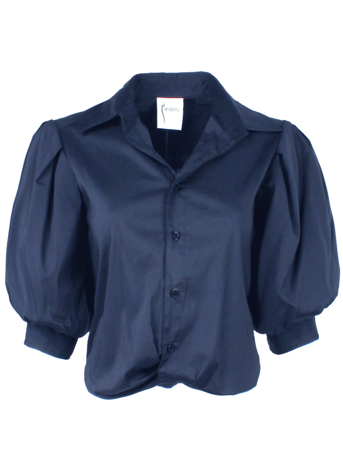 Front view of Finley Bomba silky navy poplin shirt with front twist hem, button front, elbow blouson sleeves.