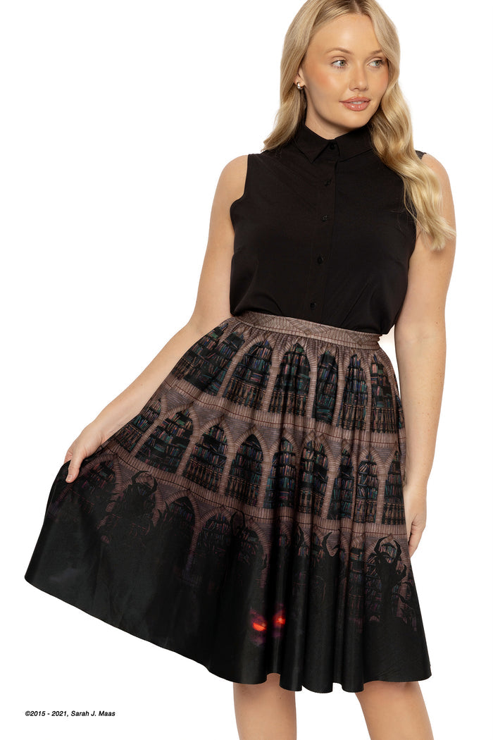 ACOTAR Bryaxis Below midi skirt, inspired by A Court of Thorns and Roses series by Sarah J Maas, featuring House of Wind library print, shelves of books, shadowy creature detail and glowing eyes, midi length fantasy outfit