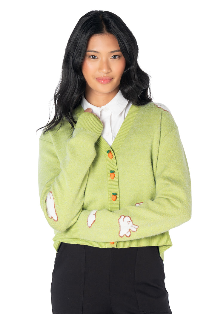 Cute cropped cardigan featuring fluffy bunny knit artwork, carrot-shaped button closures and a cosy green knit perfect for cottagecore and kawaii fashion.