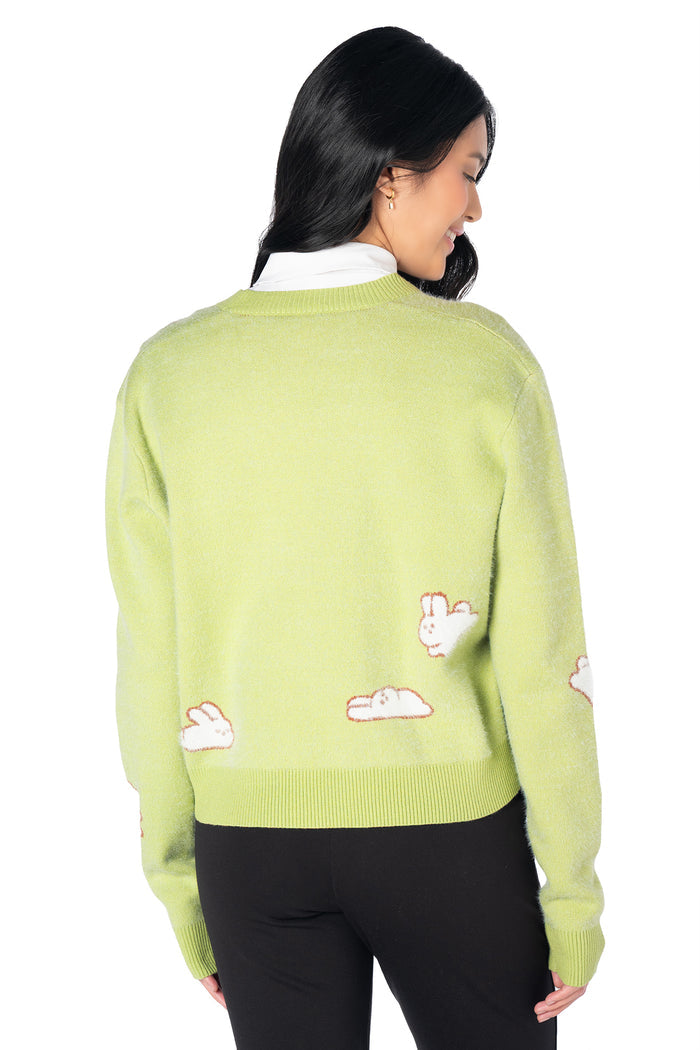 Soft green knit cardigan showcasing an all-over bunny pattern, cropped silhouette and carrot-shaped button front for cute casual outfits and cottagecore-inspired looks.