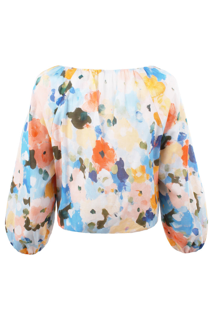 Multicolored floral-patterned top on a white background