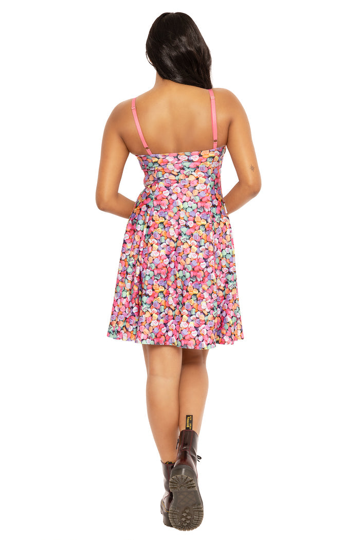 Colourful candy heart maxi dress with strappy design, combining a playful print and flowing silhouette for summer fashion, casual events, brunch dates and everyday outfits.