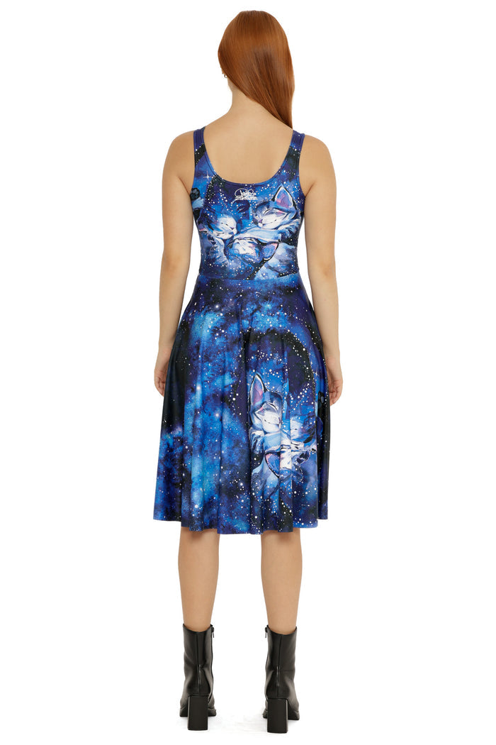 Mid-length scoop neck dress with an all-over celestial print, featuring deep blues, star details, and illustrated characters.