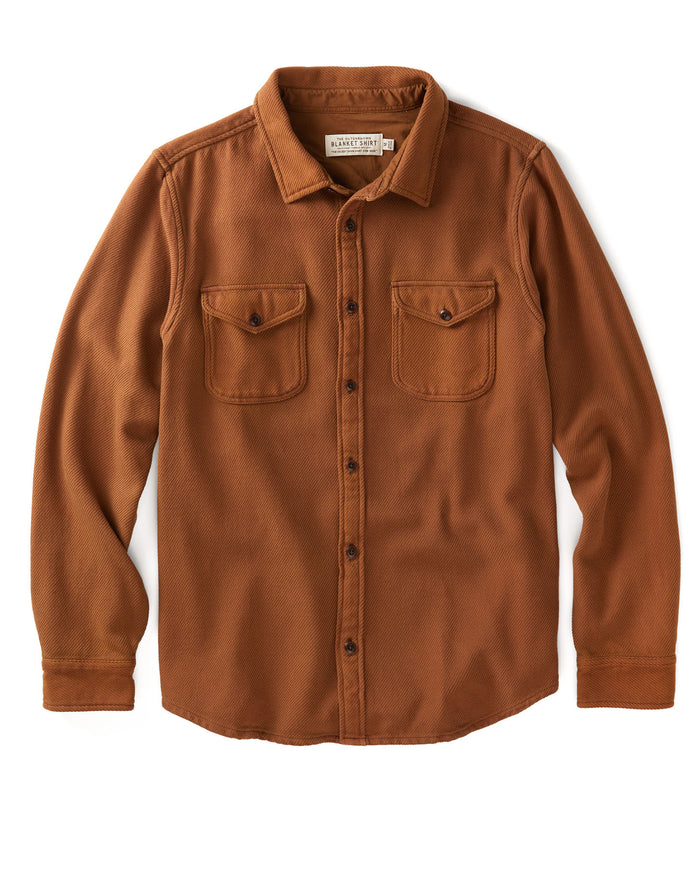 Brown button-up shirt with two chest pockets on a white background