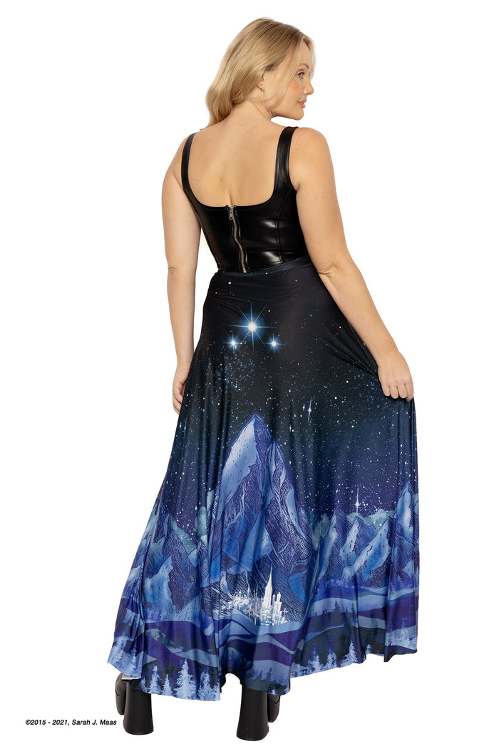 A Court of Thorns and Roses City of Starlight skirt, ACOTAR inspired maxi skirt by Sarah J Maas with Velaris artwork, glowing city lights, mountain detail and soft flowing silhouette, Night Court aesthetic