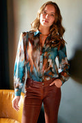 Model wearing the Finley Collette blouse, a women's cotton voile blouse with a green floral autumn print.