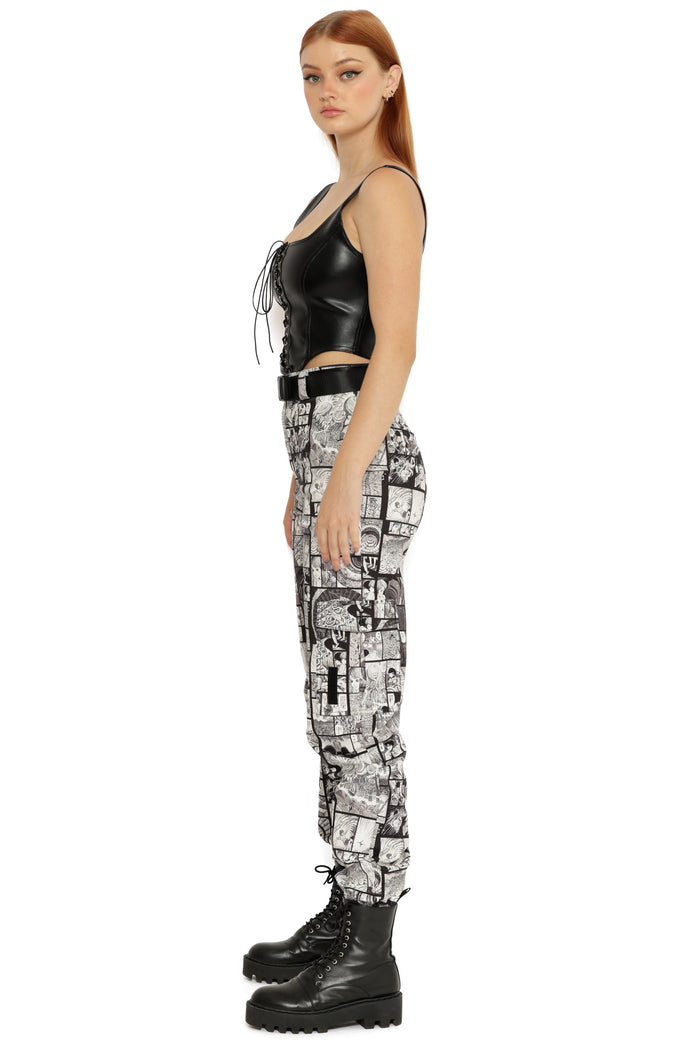 Black and white manga print cargo pants inspired by Junji Ito Uzumaki, high rise women’s utility trousers with buckle belt, zip fly and structured cargo pocket detailing.
