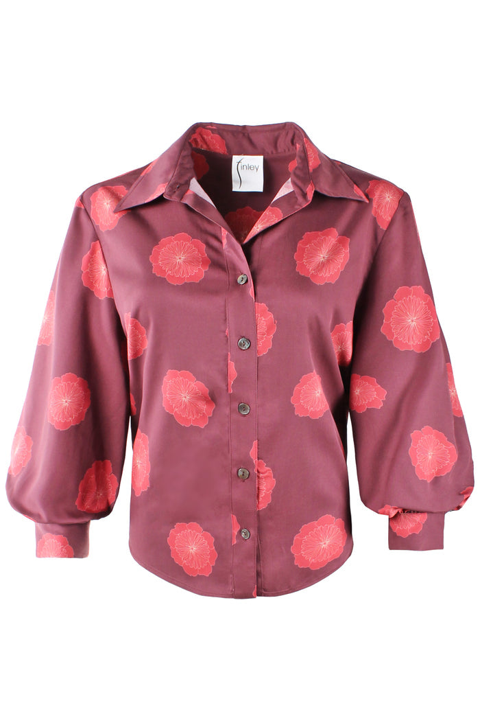 A long-sleeve button-up shirt in a dusty rose or mauve color, featuring a bold pink and red floral print, displayed on a clean white background.