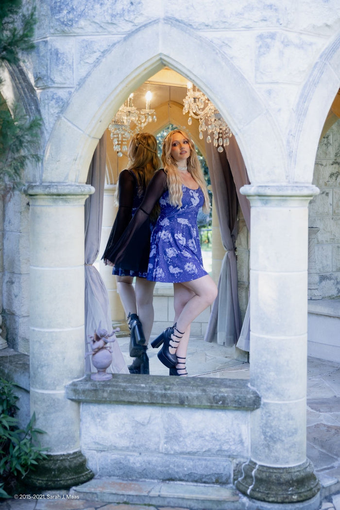 A Court of Thorns and Roses order series Court of Dreams dress, ACOTAR scoop skater dress by Sarah J Maas with midnight celestial print, scoop neckline, pockets and flared silhouette, fantasy fashion piece