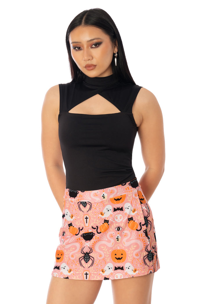 BlackMilk Coven Cutie Skort – pink witch, pumpkin and black cat Halloween print skort, part of the BlackMilk Clothing Halloween collection