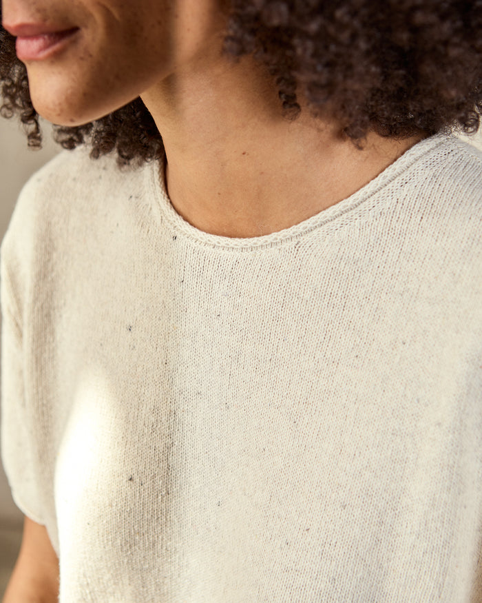 close shot of cream woven t-shirt