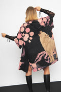 Crying at the Moon Robe featuring a wolf howling beneath the moon, designed with a flowing silhouette and comfortable fit for lounging, layering and everyday alternative fashion.