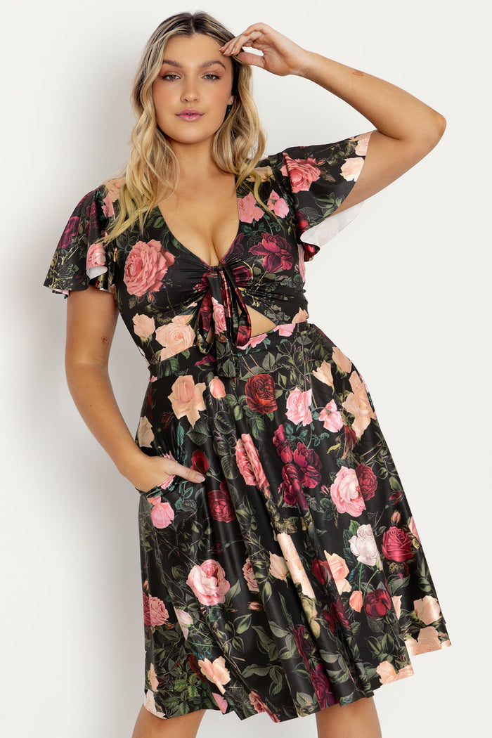 Black floral midi dress with dark rose print, designed with a comfortable stretch fit and elegant shape for office outfits, evening wear and versatile day-to-night dressing.