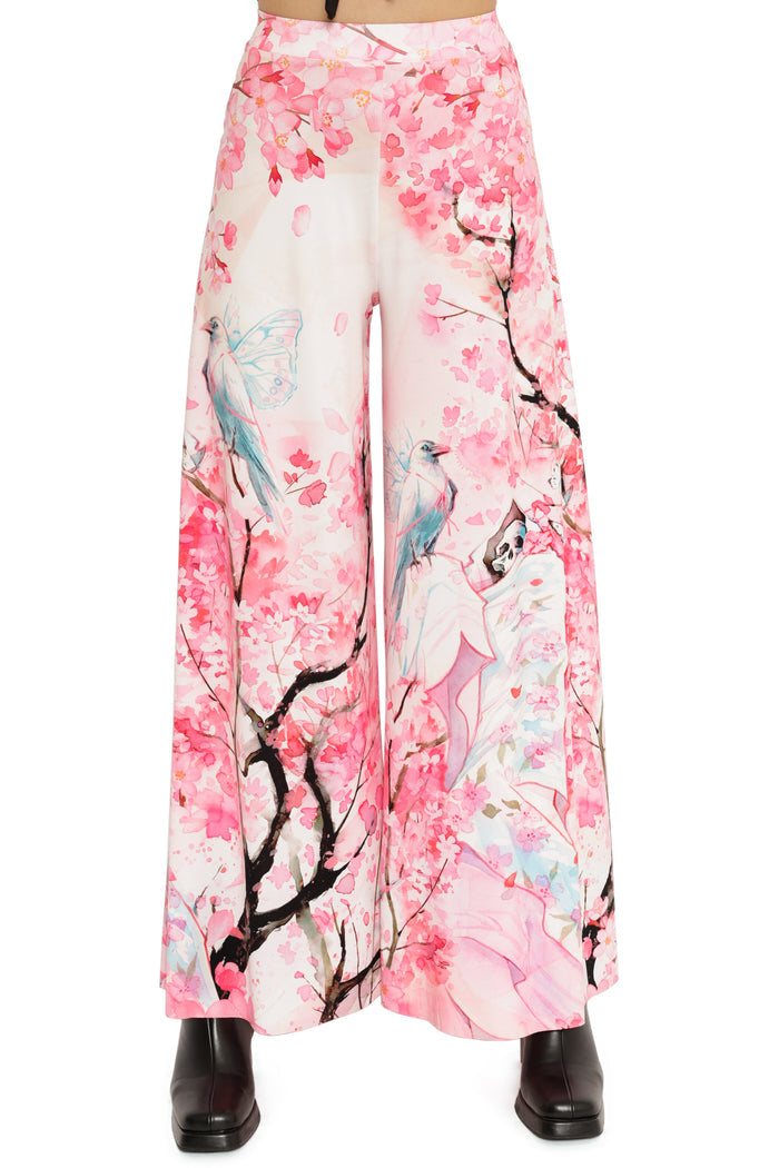 Wide-leg pants with cherry blossom and bird design on a white background