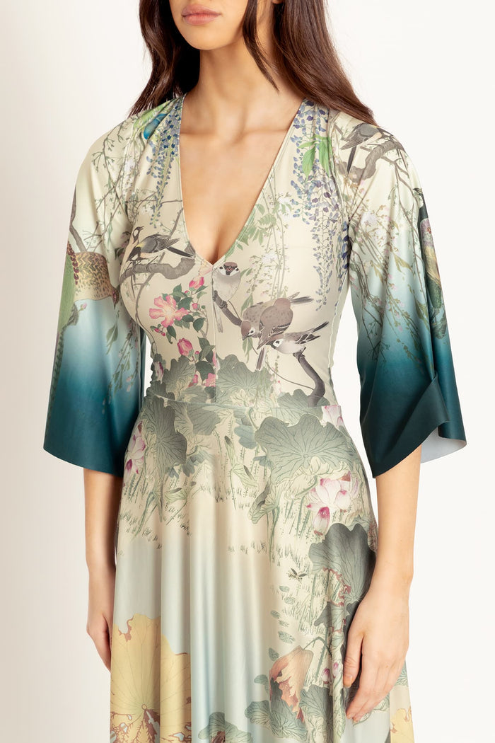 Women's maxi dress with koi fish print and wide sleeves, designed for comfortable wear and eye-catching style across events, celebrations and everyday fashion.