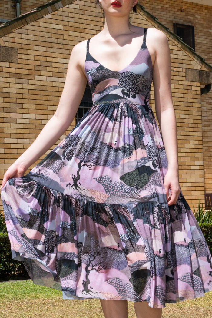 Edge of Night Sheer Midaxi Dress featuring semi sheer fabric, full flowing skirt, fitted bodice and artistic tree print in soft dusky tones