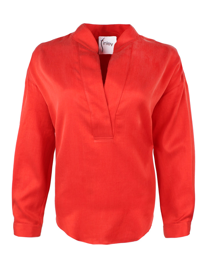 A front view of the Elsa shirt with a v-neckline, relaxed shape, drop shoulders, and teal cupro cotton.