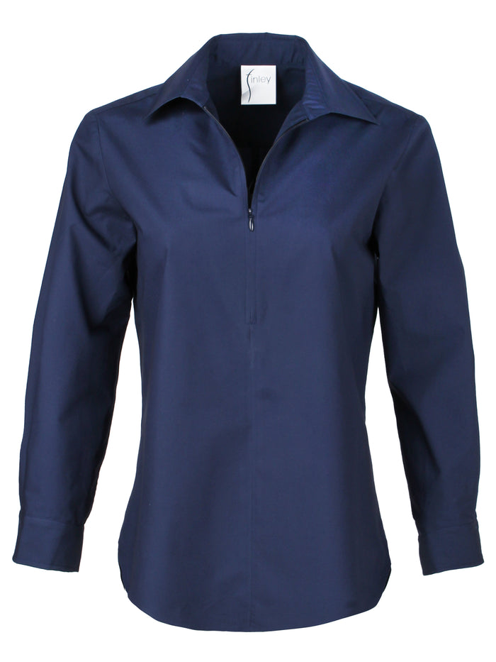 A model wearing the Finley Endora, a half-zip 100% cotton sateen stretch poplin pullover blouse in navy.