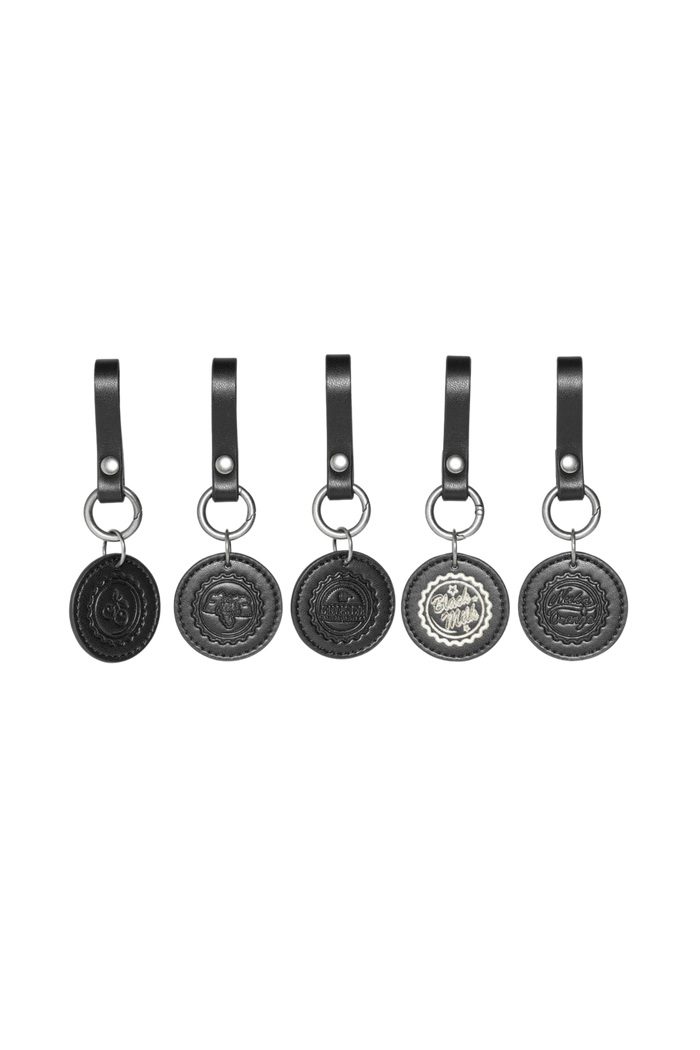Set of five Fallout x BlackMilk Cap Currency charms made from black faux leather with embossed bottle cap logos.