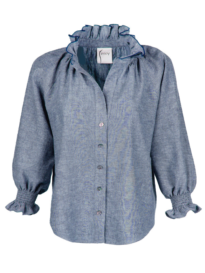 Blue shirt with smocked shoulders on a white background