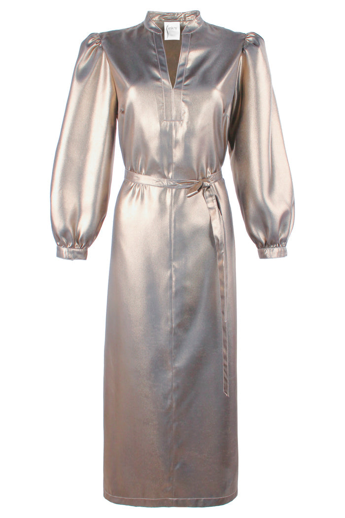 Front view of Franchesca, a silver Finley dress in an elegant room with a white wall and gold accents.