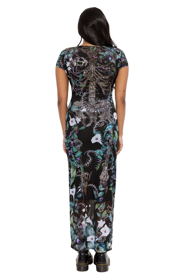 Gothic floral bodycon dress with sheer mesh layers, poison blooms and skeletal artwork wrapped throughout the design. Featuring cap sleeves, a crew neckline and a flattering midaxi silhouette, this alternative goth dress is perfect for fantasy witch and dark academia styling.