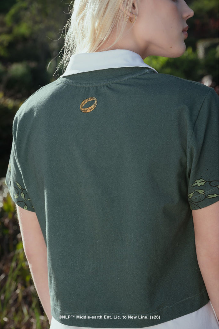 Close-up campaign shot of the Greetings From Hobbiton Cotton Baby Tee by BlackMilk, showing the Shire-inspired graphic print on soft blue cotton fabric.