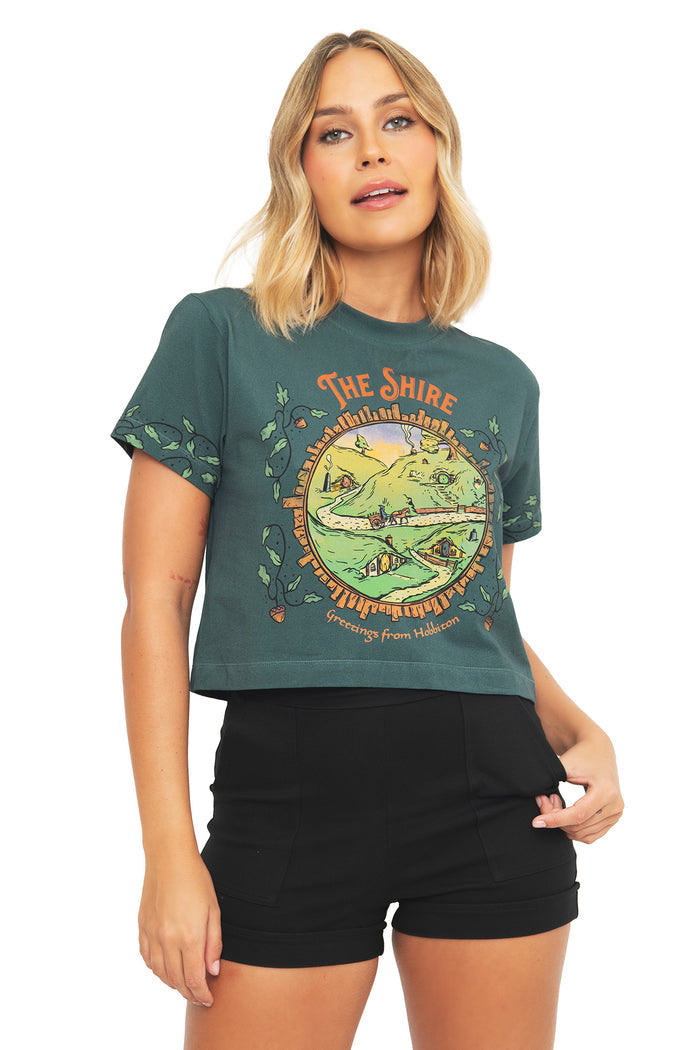 Close-up front view of the BlackMilk Lord of the Rings Greetings From Hobbiton Baby Tee, showing the graphic print detail on the cropped cotton tee.