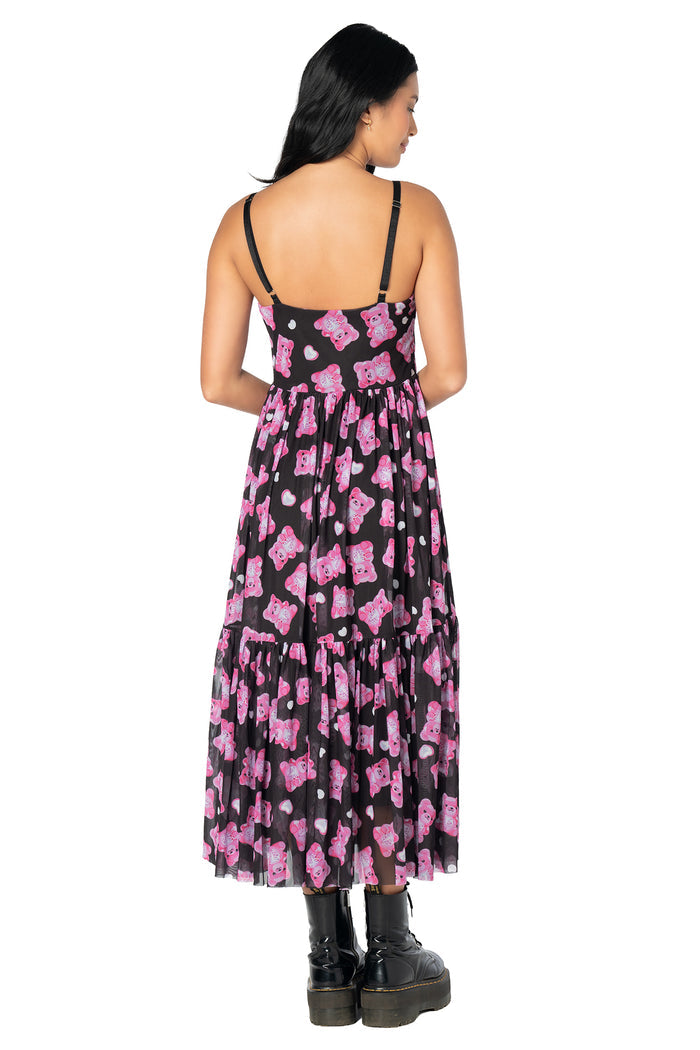 Women's sheer midaxi dress featuring a whimsical pink gummy bear print, floaty black mesh overlay, adjustable straps and a soft knee-length lining for comfortable wear.
