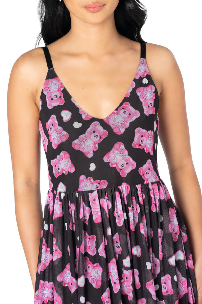 BlackMilk sheer midaxi dress featuring playful pink gummy bear graphics, floaty mesh fabric, adjustable straps and a lined skirt for effortless alternative styling.